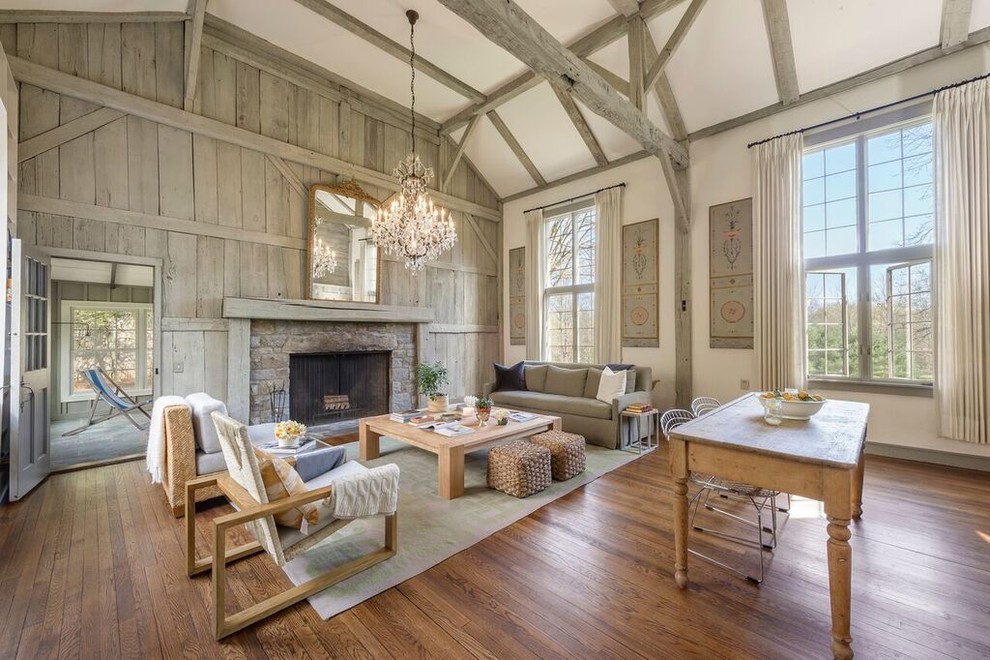 Large cottage open concept dark wood floor living room photo in Other with a standard fireplace, white walls and a stone fireplace