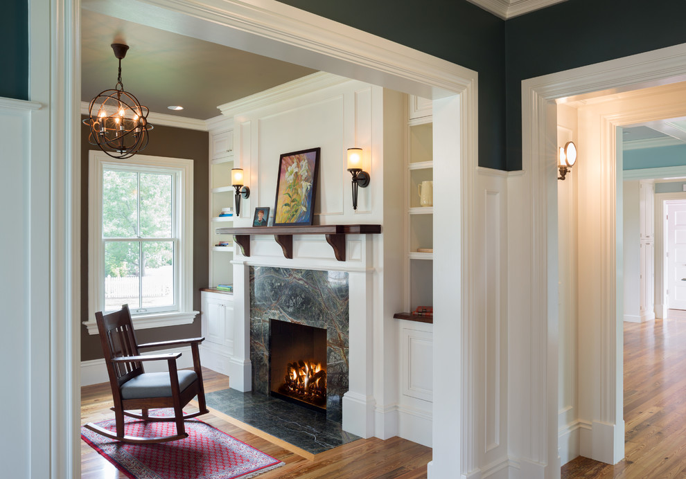 Inspiration for a small country formal and enclosed medium tone wood floor living room remodel in Providence with brown walls, a standard fireplace and a tile fireplace