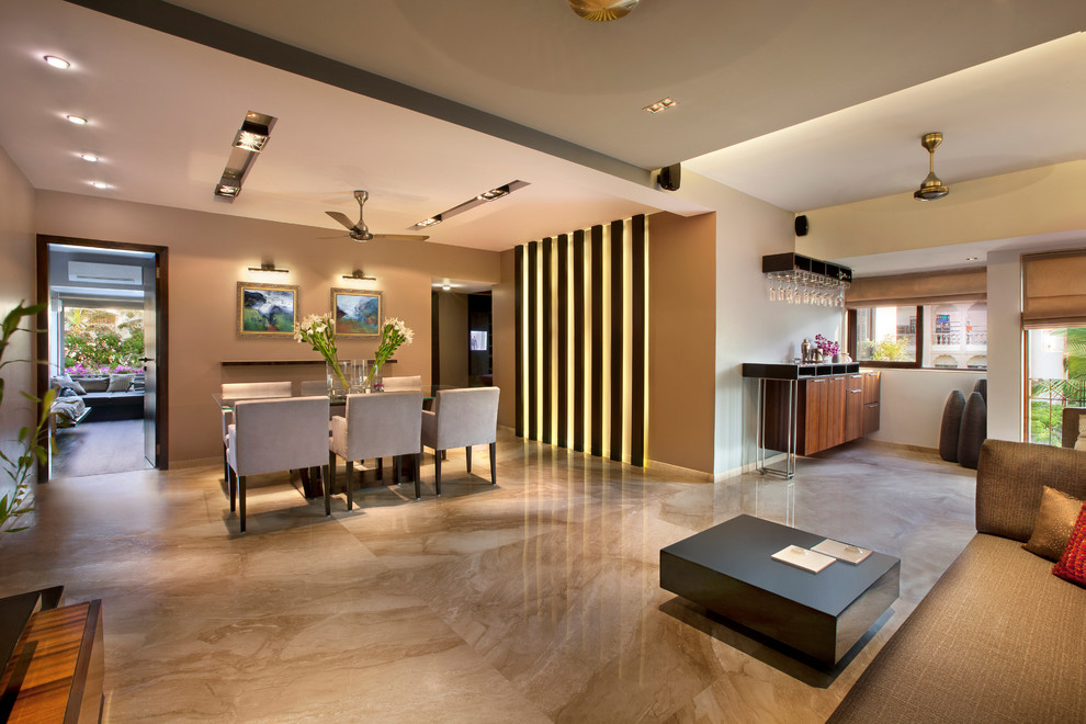 Ejemplo de salón con barra de bar moderno con suelo de mármol y suelo beige