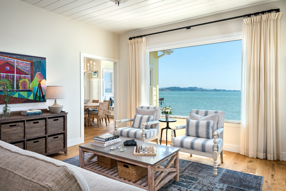 Design ideas for a medium sized nautical open plan living room in San Francisco with beige walls, medium hardwood flooring and beige floors.
