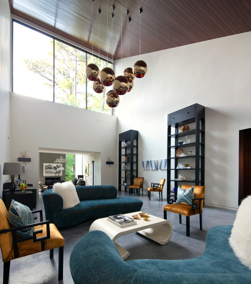 Foto di un soggiorno design con sala formale, pareti bianche e pavimento in cemento
