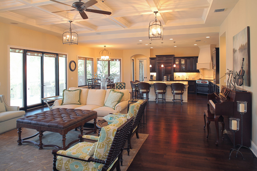 This is an example of a mediterranean open plan living room in Tampa with beige walls.