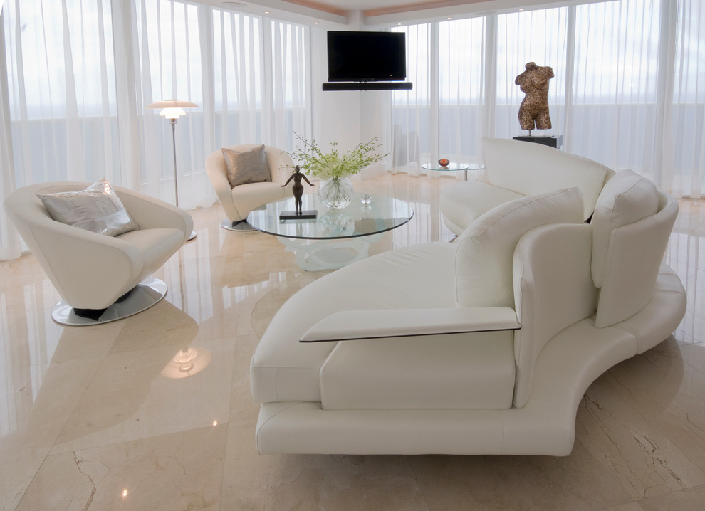 Living room - mid-sized contemporary formal and open concept marble floor living room idea in Miami with beige walls, no fireplace and a wall-mounted tv