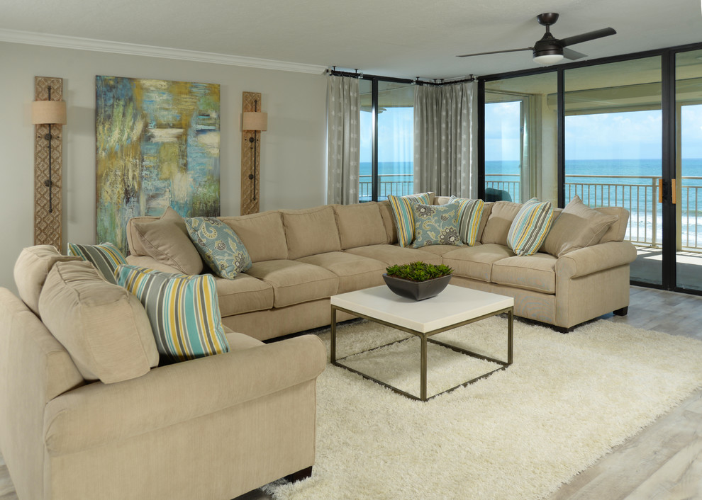 Photo of a large nautical open plan living room in Orlando with grey walls, light hardwood flooring, white floors and a wall mounted tv.