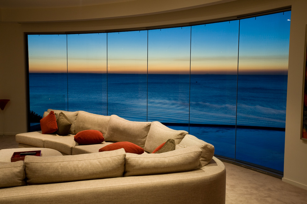 Mid-sized beach style open concept carpeted living room photo in Melbourne with white walls, no fireplace and a tv stand