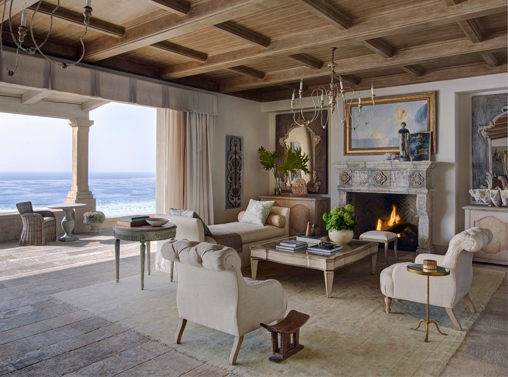 Design ideas for a mediterranean formal open plan living room curtain in Orange County with beige walls, medium hardwood flooring, a standard fireplace, a tiled fireplace surround and no tv.