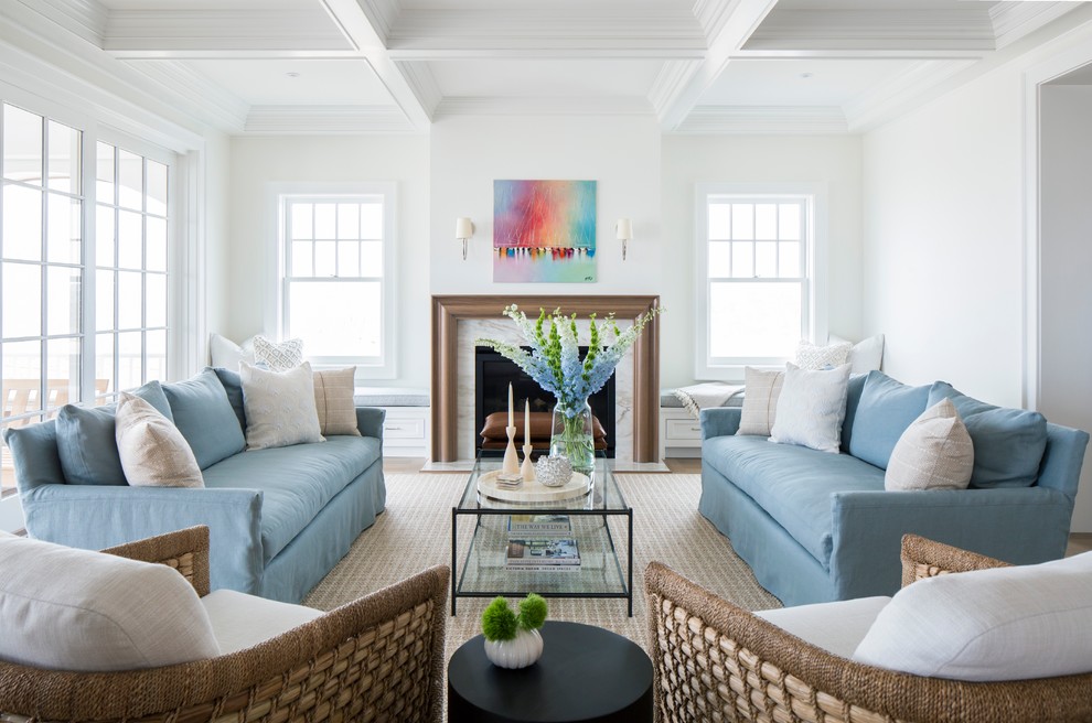 Inspiration for a large coastal formal and open concept brown floor and medium tone wood floor living room remodel in Other with white walls, a standard fireplace, a stone fireplace and no tv