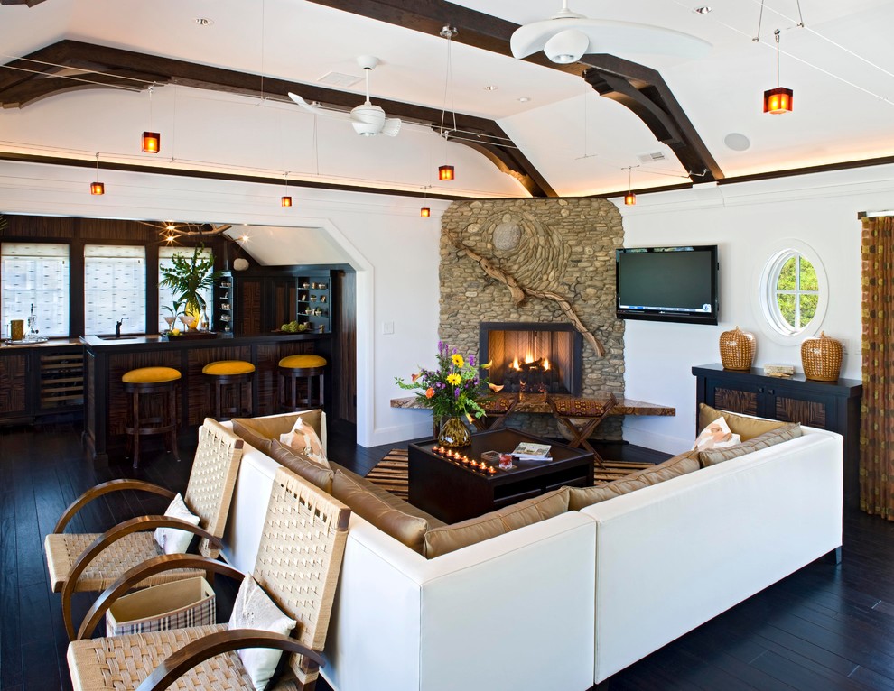 Beach style open concept living room photo in DC Metro with a bar, a corner fireplace, a stone fireplace and a wall-mounted tv