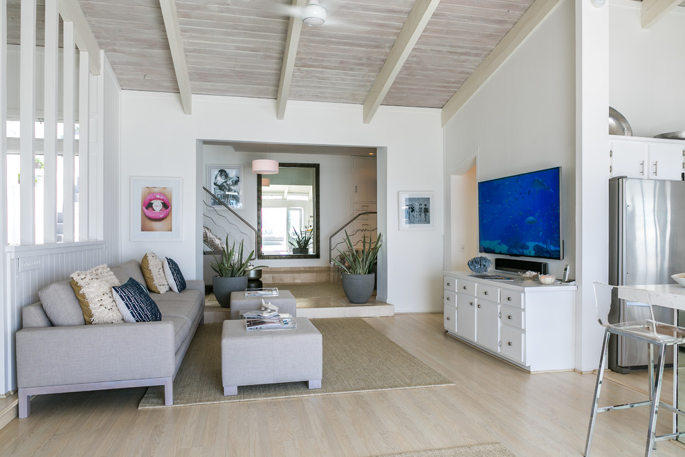 Inspiration for a medium sized coastal formal open plan living room in Los Angeles with white walls, light hardwood flooring and a wall mounted tv.