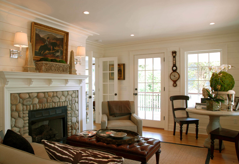 Example of a mid-sized beach style formal and enclosed medium tone wood floor living room design in New York with a stone fireplace, white walls and a standard fireplace
