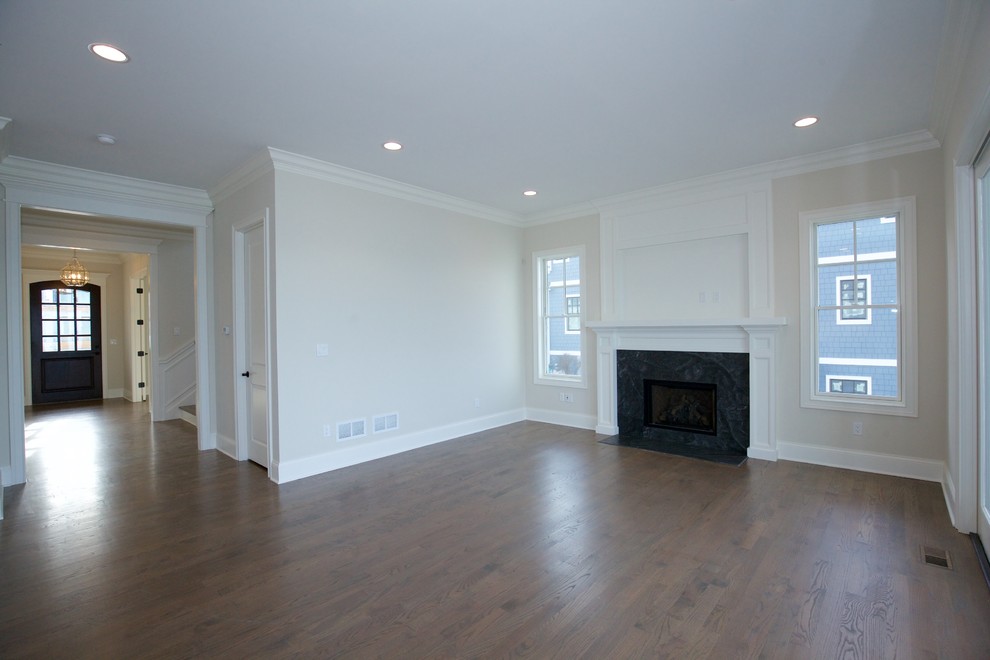 Medium sized traditional formal enclosed living room in Chicago with beige walls, dark hardwood flooring, no fireplace and no tv.