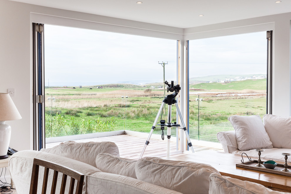 Inspiration for a coastal living room remodel in Devon
