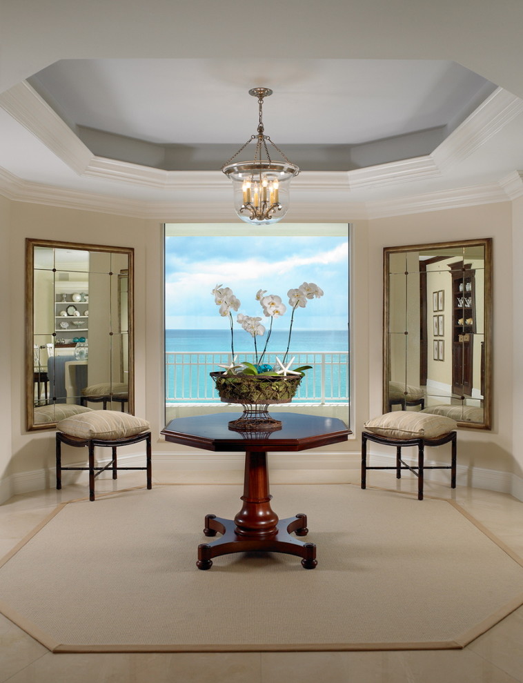 Living room - coastal living room idea in Miami with beige walls