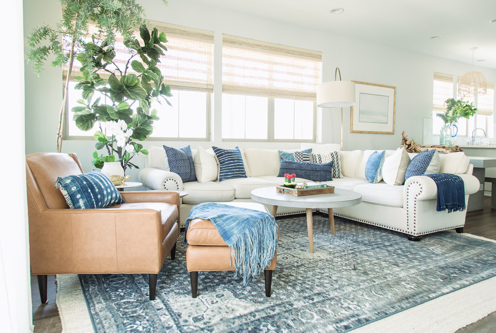Inspiration for a medium sized nautical open plan living room in Orange County with grey walls, a wall mounted tv, carpet and feature lighting.