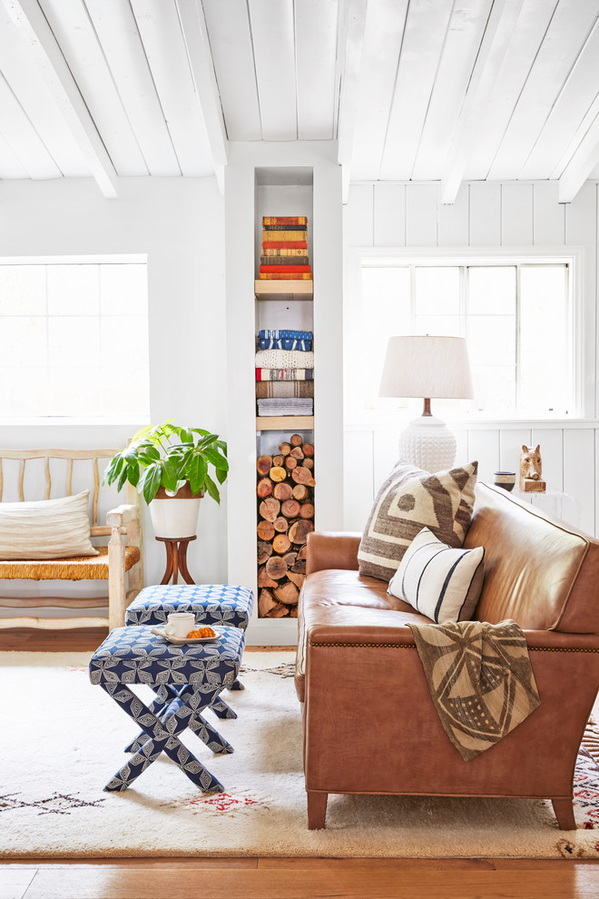 Living room - small coastal open concept light wood floor living room idea in Los Angeles with white walls