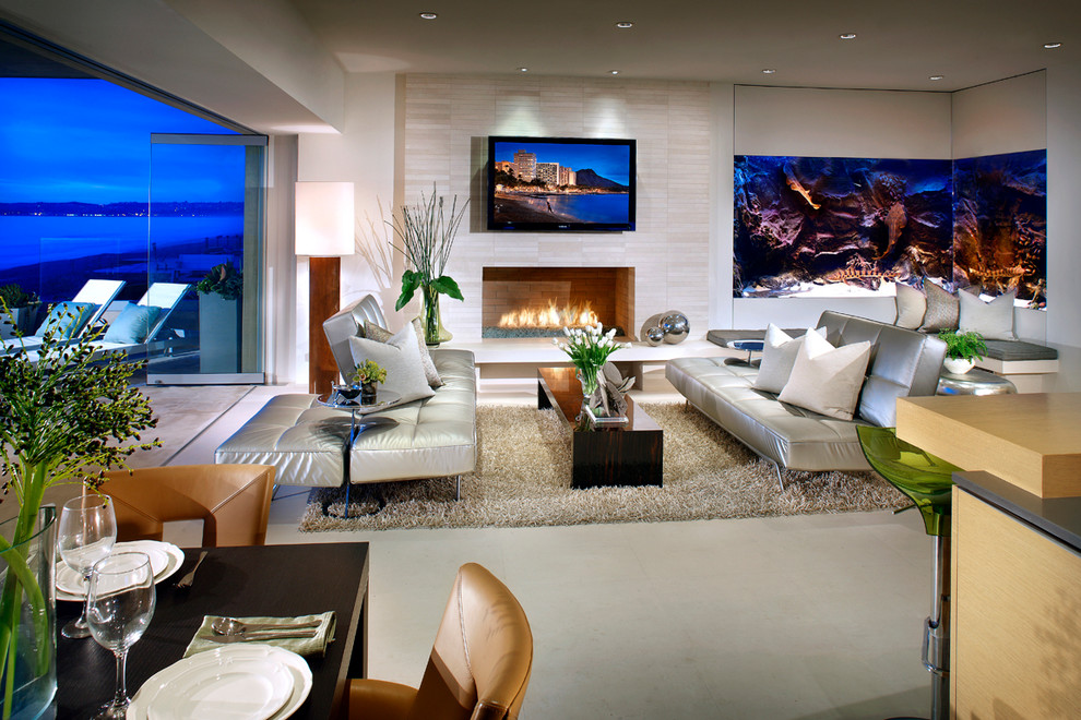 Inspiration for a large nautical open plan living room in Orange County with beige walls, a standard fireplace, a tiled fireplace surround and a wall mounted tv.