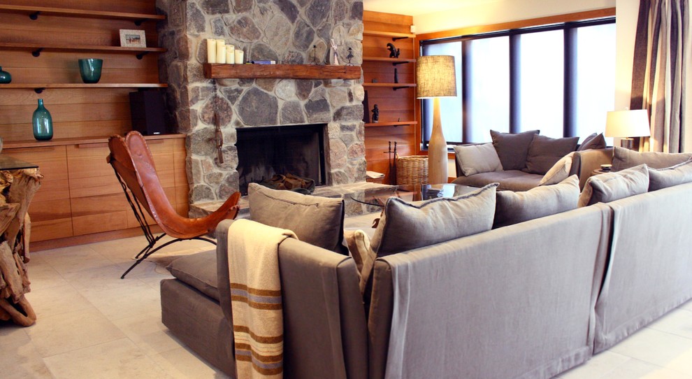 Rustic open plan living room in Toronto with white walls, a standard fireplace and a stone fireplace surround.