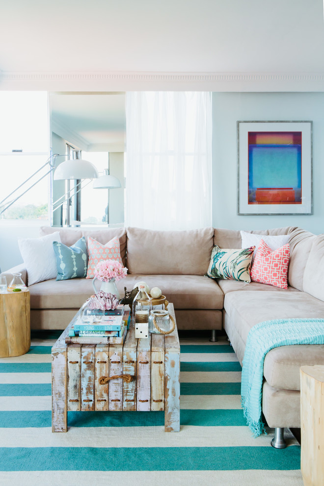 Example of a mid-sized beach style open concept living room design in Sydney with white walls