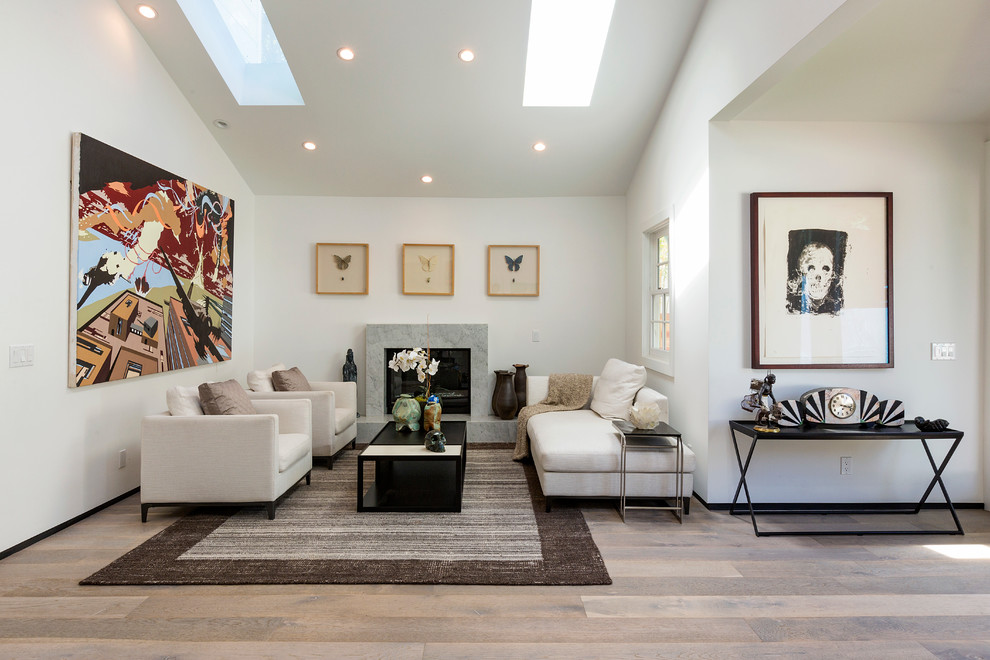 Inspiration for a contemporary formal and open concept medium tone wood floor living room remodel in Los Angeles with a standard fireplace, a stone fireplace and white walls