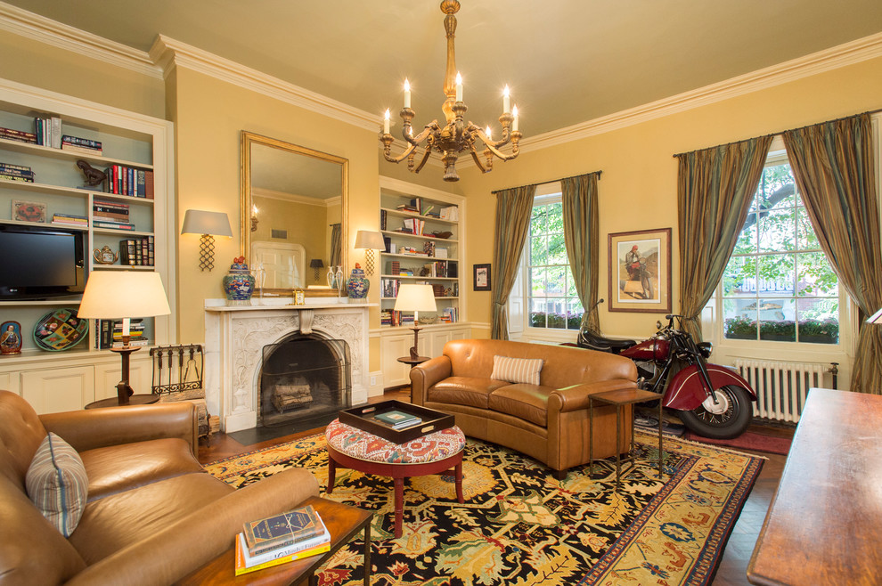 Inspiration for a traditional living room in Boston with yellow walls.