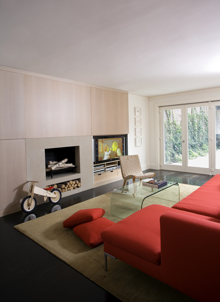 Modern living room in Boston with a standard fireplace and a built-in media unit.