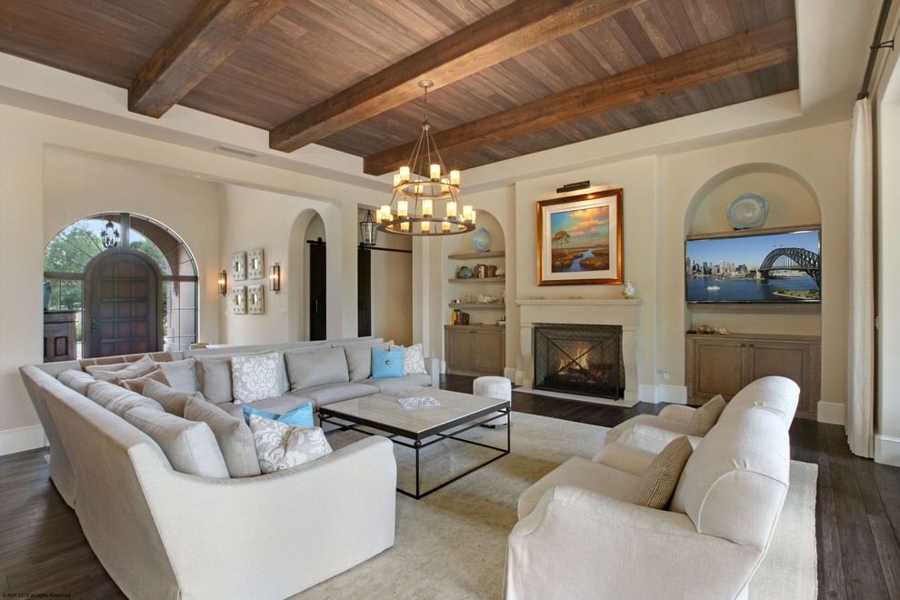 Inspiration for a large mediterranean formal open plan living room in Miami with beige walls, dark hardwood flooring, a standard fireplace, a stone fireplace surround, no tv and grey floors.