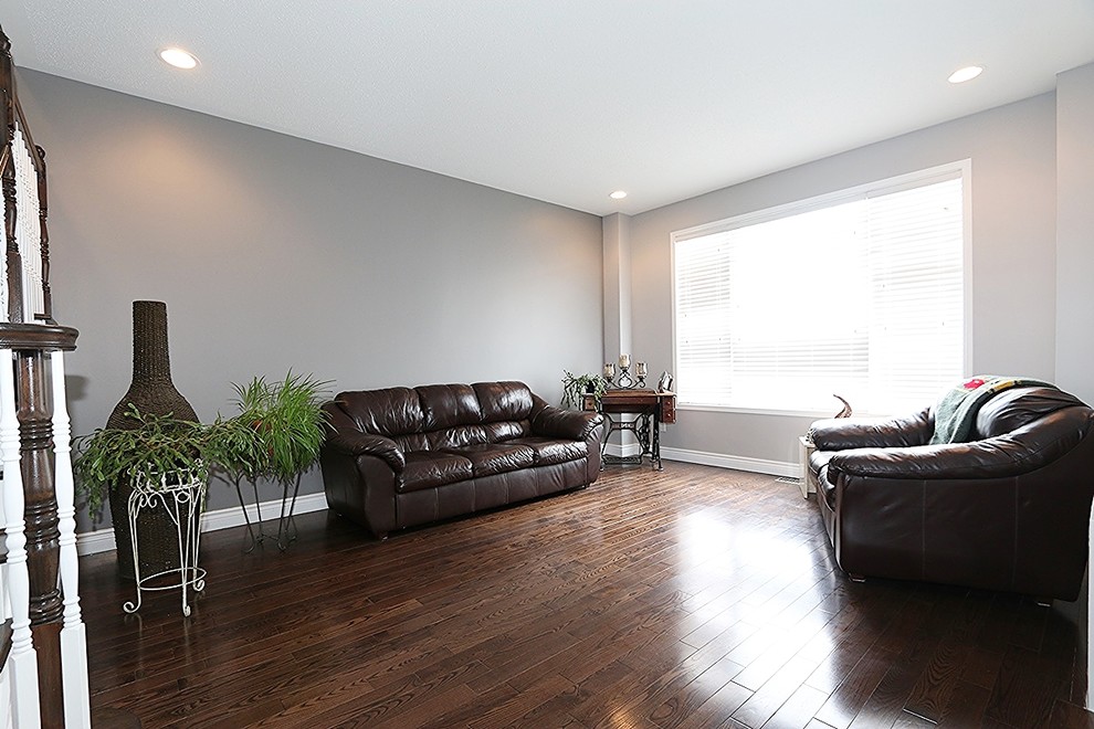 Inspiration for a modern living room in Ottawa with grey walls, dark hardwood flooring and no tv.