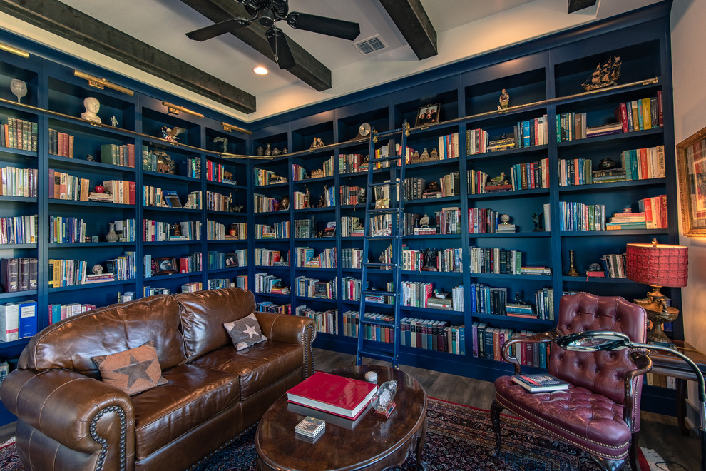 Medium sized contemporary enclosed living room in Austin with a reading nook, blue walls, medium hardwood flooring, no fireplace, no tv, brown floors and feature lighting.