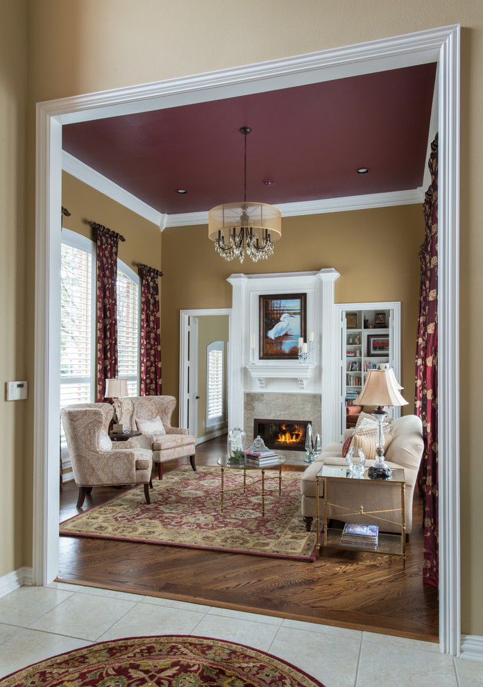 Inspiration for a medium sized traditional formal enclosed living room in Dallas with beige walls, dark hardwood flooring, a standard fireplace and a stone fireplace surround.