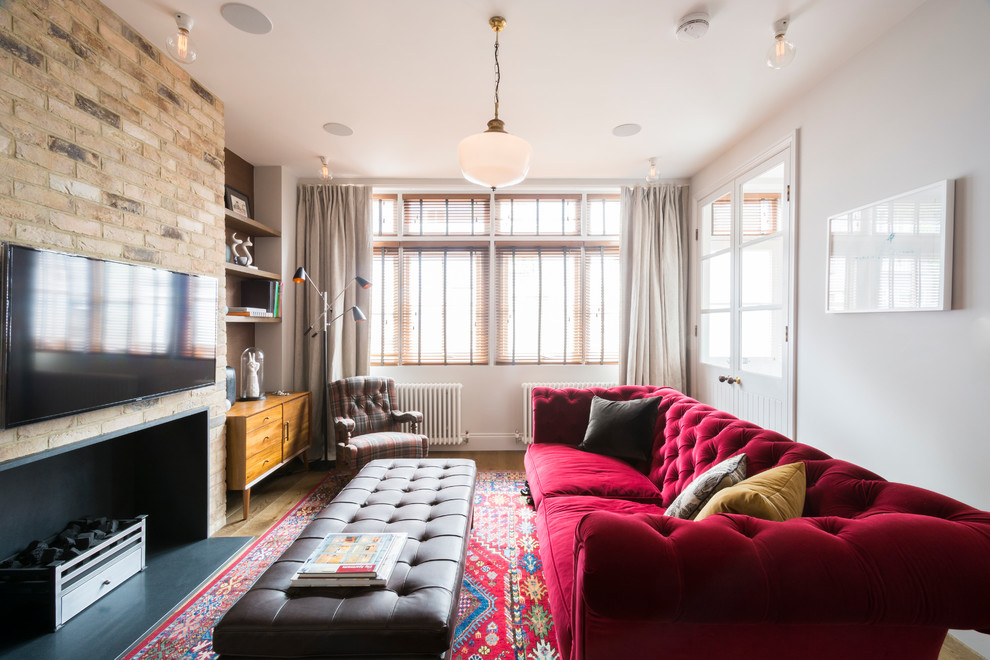 Inspiration for a timeless living room remodel in London with white walls, a ribbon fireplace and a wall-mounted tv