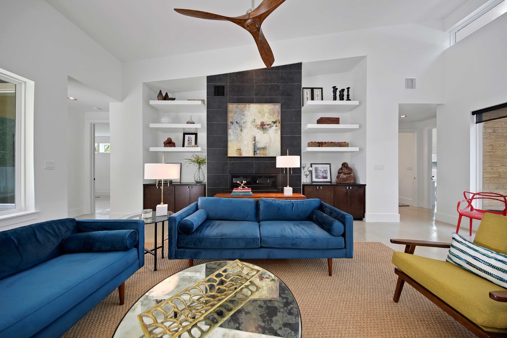 Inspiration for a mid-sized 1960s formal and open concept concrete floor and gray floor living room remodel in Austin with white walls, a ribbon fireplace, a tile fireplace and a wall-mounted tv