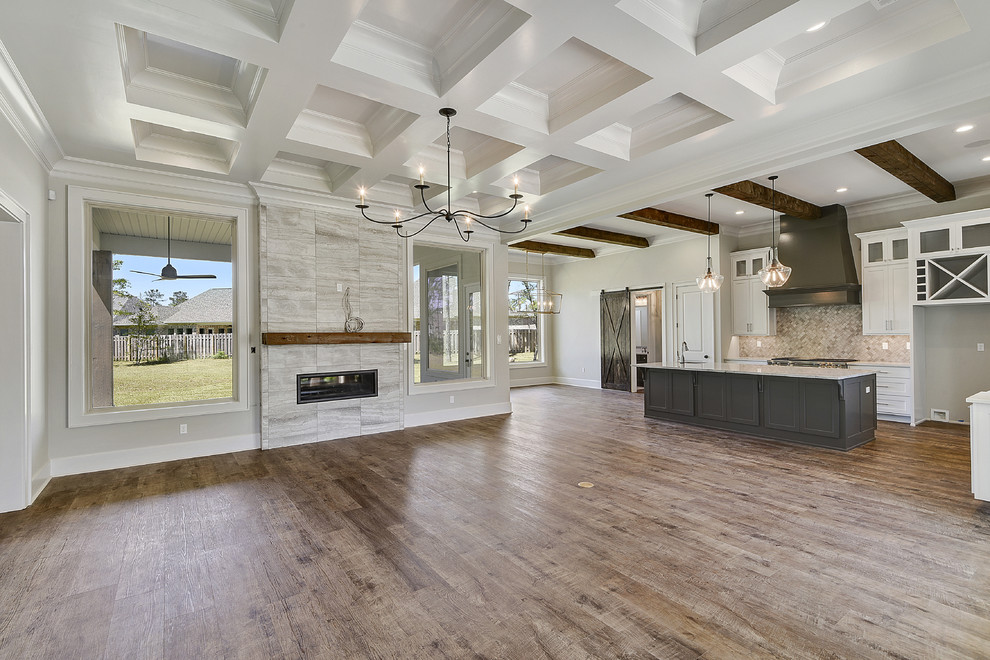 Design ideas for a large farmhouse formal open plan living room in New Orleans with grey walls, dark hardwood flooring, a ribbon fireplace, a tiled fireplace surround and grey floors.