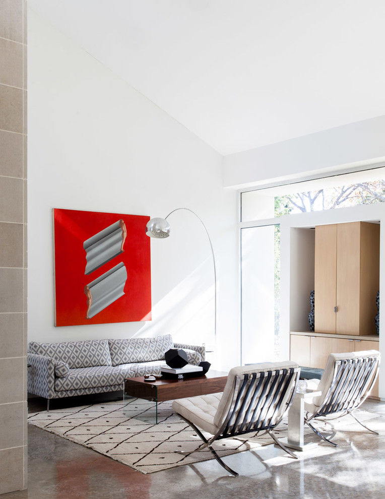 Inspiration för ett funkis vardagsrum, med betonggolv och vita väggar