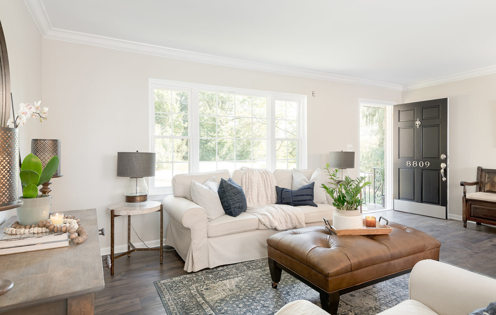 Classic formal enclosed living room in Charlotte with beige walls, dark hardwood flooring, no tv and brown floors.