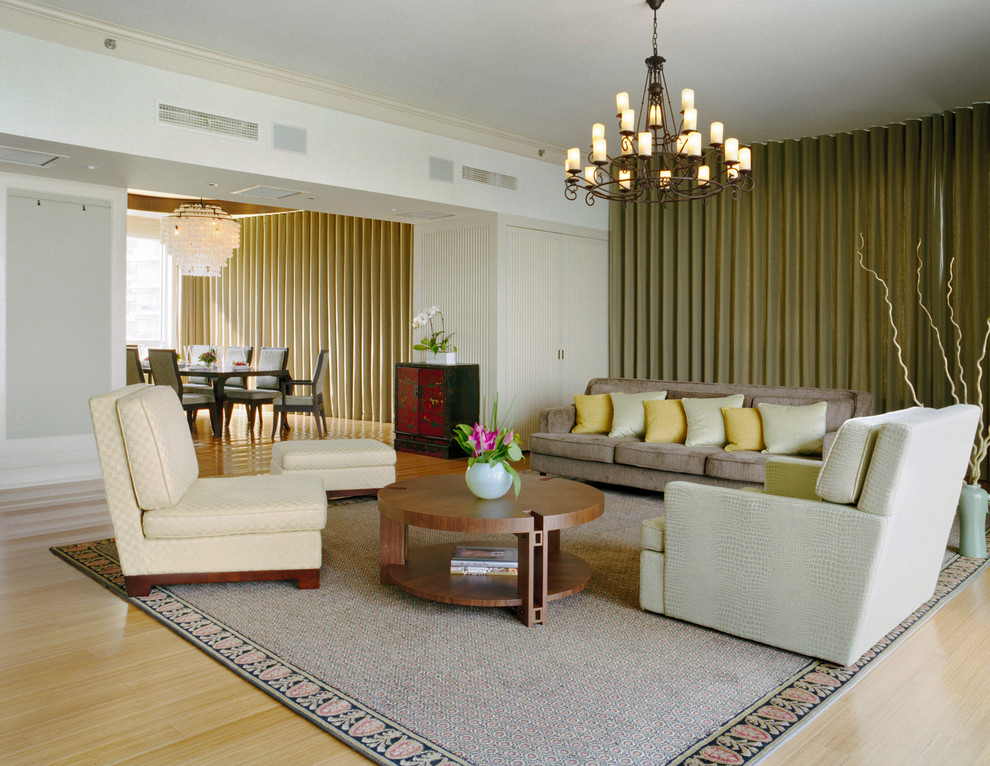 Contemporary living room in New York with light hardwood flooring.