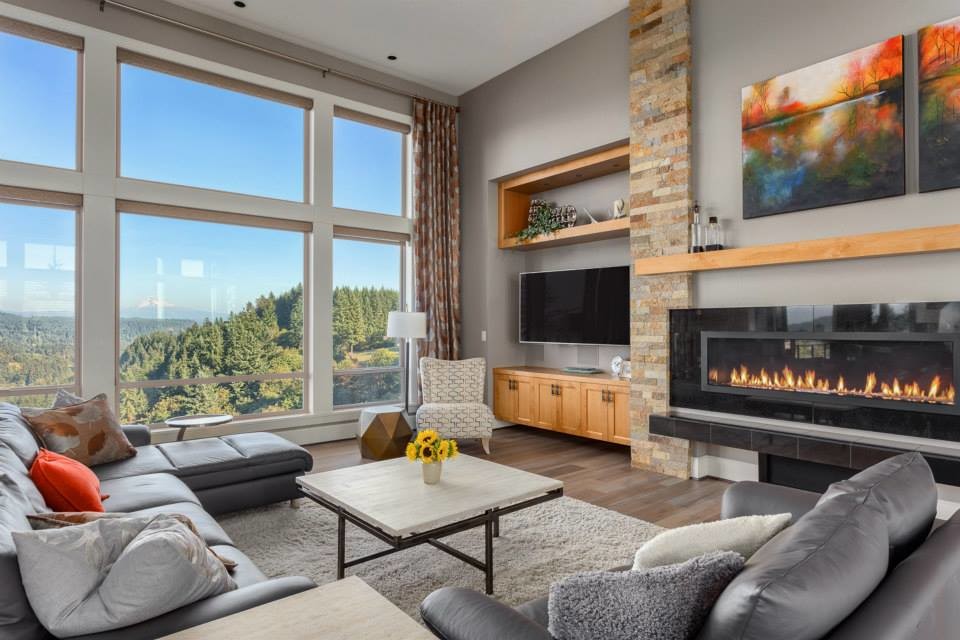 This is an example of an expansive contemporary open plan living room in Portland with grey walls, medium hardwood flooring, a ribbon fireplace, a tiled fireplace surround and a wall mounted tv.