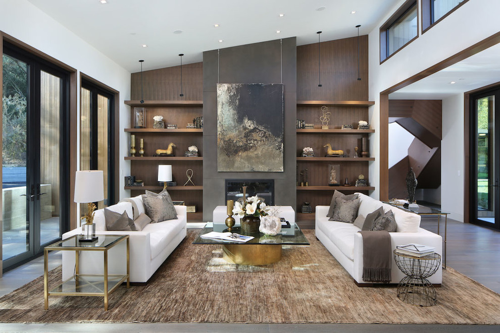 Photo of a large contemporary living room in San Francisco with a standard fireplace, no tv and feature lighting.