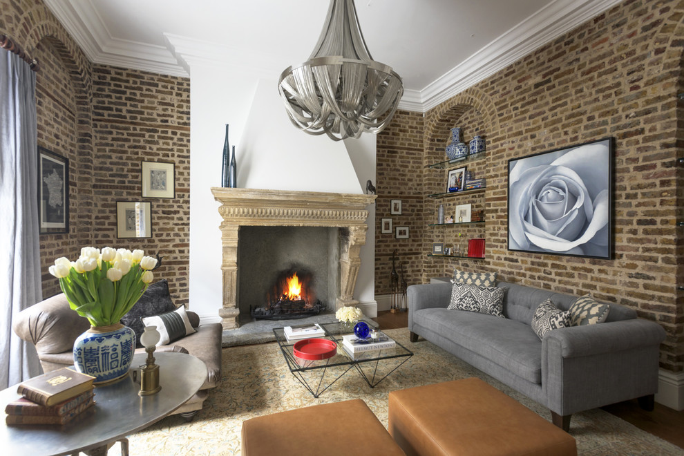 Photo of a medium sized eclectic enclosed living room in London with a standard fireplace and brown floors.