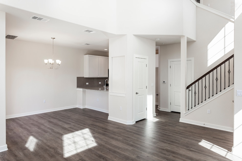 Medium sized classic mezzanine living room in Austin with white walls, lino flooring, no fireplace, a wall mounted tv and grey floors.