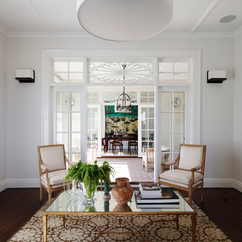 Inspiration for a large timeless dark wood floor living room remodel in Sydney with white walls