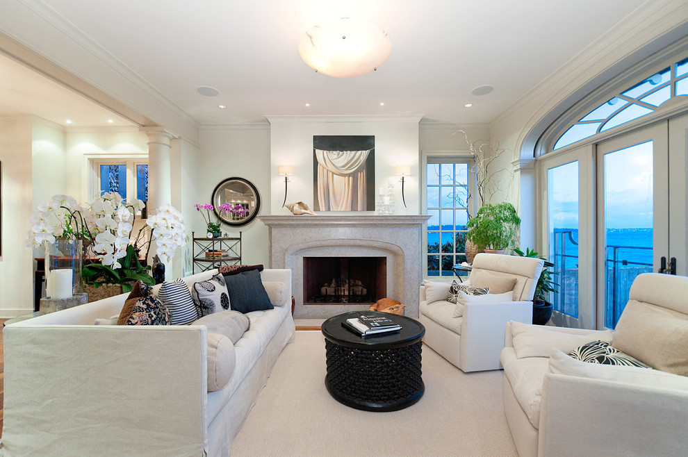 Inspiration for a medium sized contemporary living room in Vancouver with white walls and a standard fireplace.