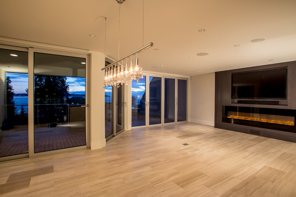 Example of a large minimalist open concept light wood floor living room design in Vancouver with white walls, a ribbon fireplace and a media wall