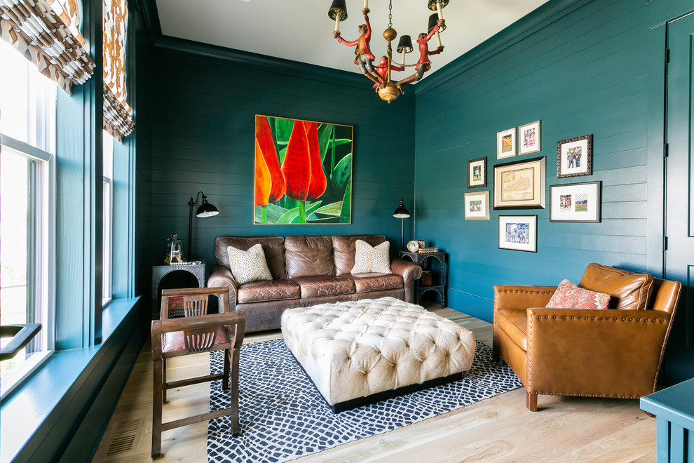 Living room - coastal enclosed light wood floor and beige floor living room idea in Charleston with blue walls