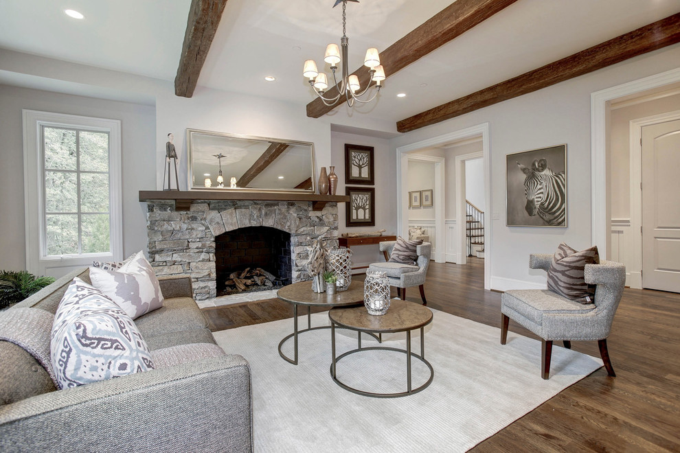 Inspiration for a large craftsman formal and open concept medium tone wood floor living room remodel in DC Metro with white walls, a standard fireplace and a stone fireplace