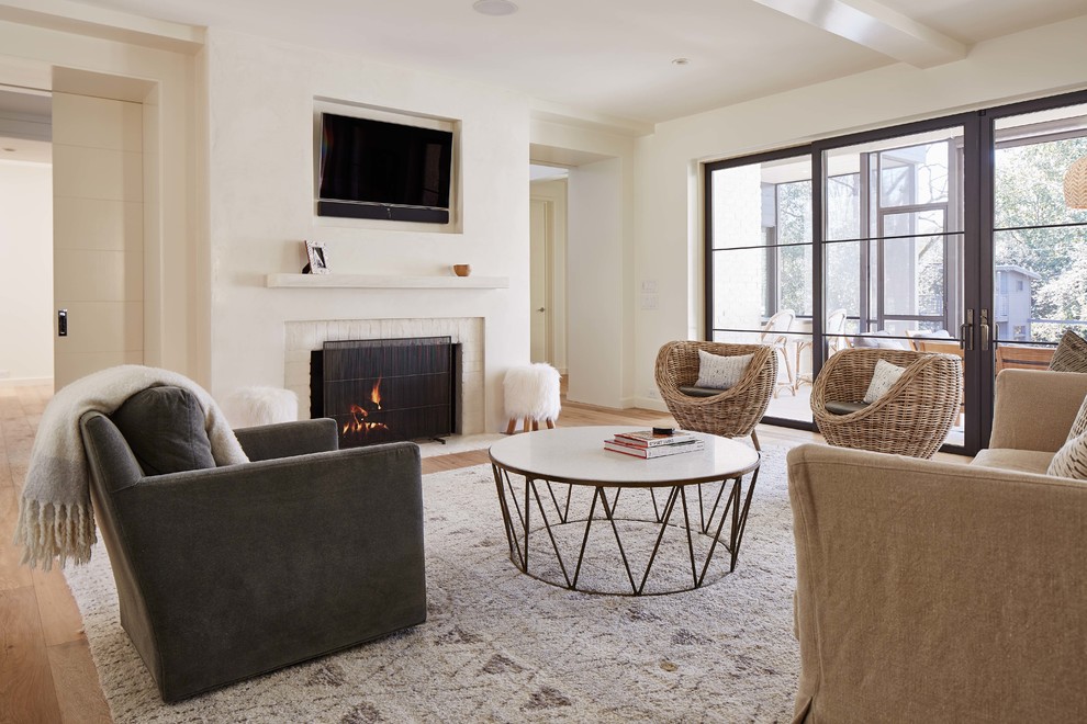 Example of a mid-sized transitional open concept light wood floor living room design in Charlotte with a standard fireplace, a brick fireplace, a wall-mounted tv and white walls