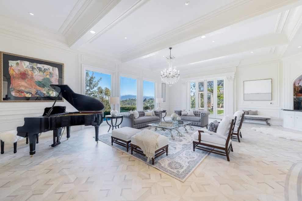 Classic open plan living room in Los Angeles with a music area, white walls, no fireplace, no tv, multi-coloured floors, a coffered ceiling and panelled walls.
