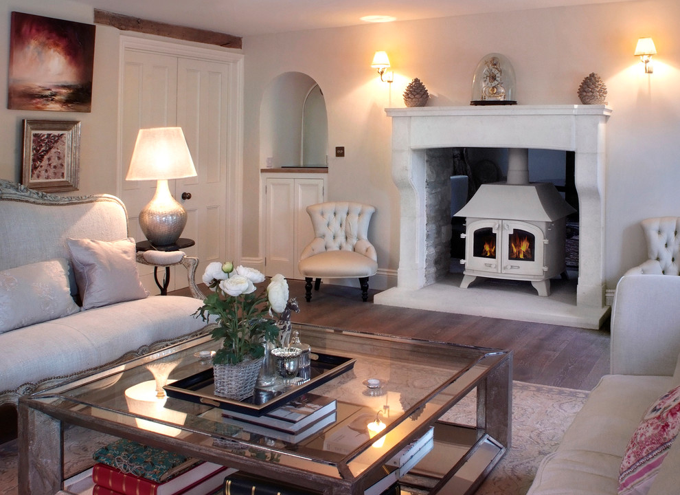 Example of a classic living room design in Other with a stone fireplace
