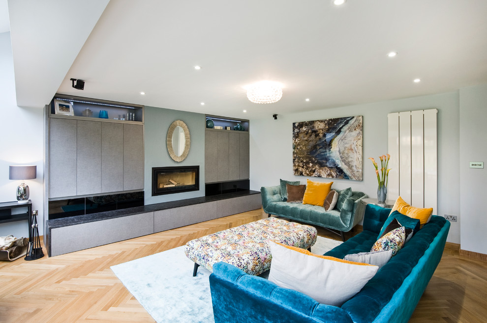 Design ideas for a grey and teal living room in West Midlands.