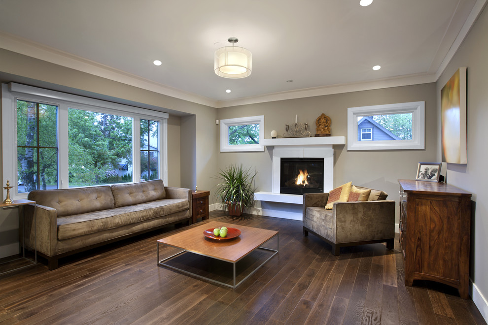 Design ideas for a contemporary living room in Vancouver with grey walls and a standard fireplace.