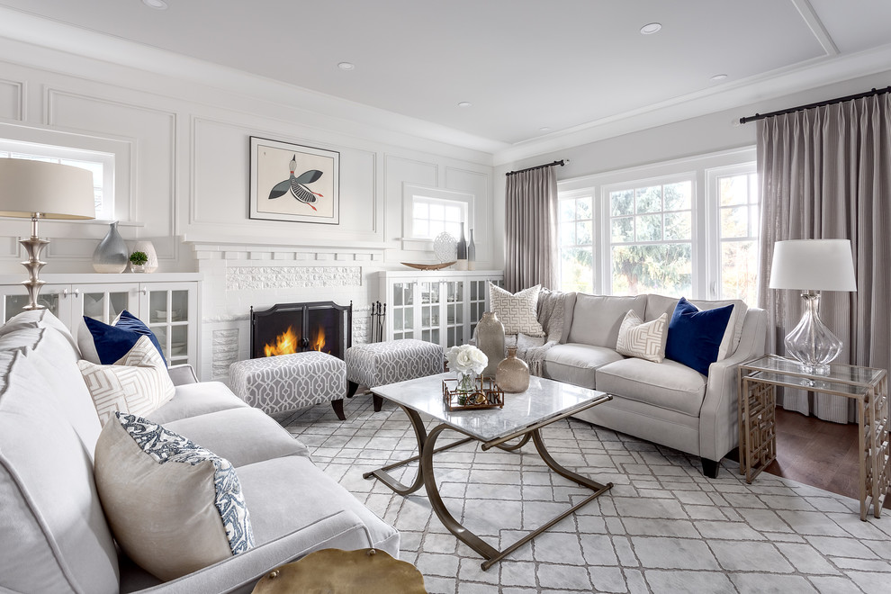 Inspiration for a medium sized traditional formal open plan living room in Vancouver with white walls, a standard fireplace, a brick fireplace surround, brown floors and dark hardwood flooring.